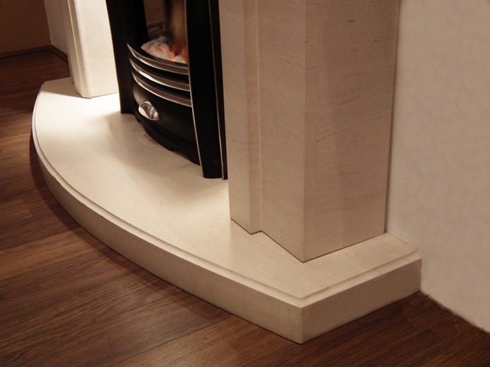 Mirage limestone fireplace with lights