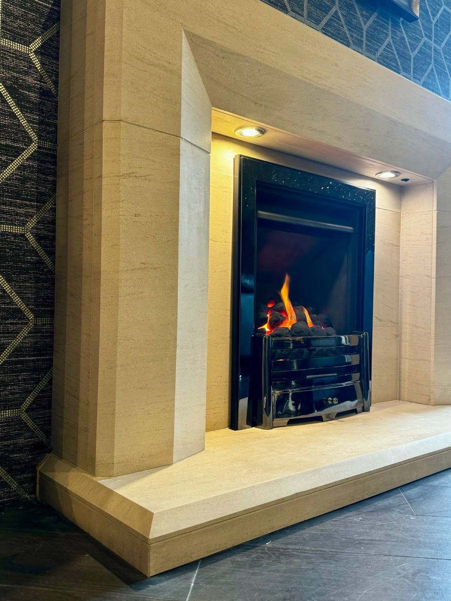 Optica Limestone fireplace with lights